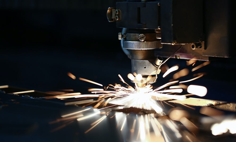 Sparks fly out machine head for metal processing