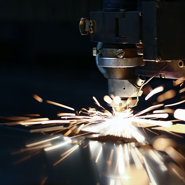 Sparks fly out machine head for metal processing